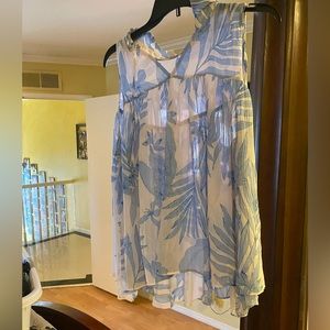 Light blue and white sleeveless shirt